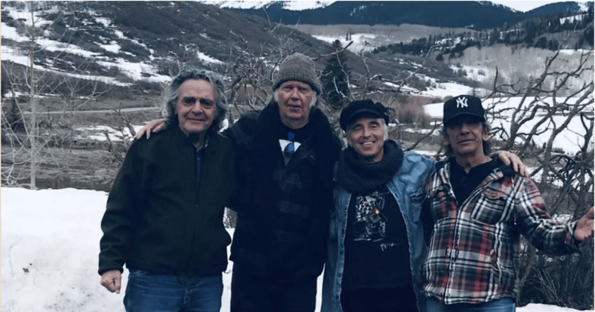 Billy Talbot, from left, Neil Young, Nils Lofgren and Ralph Molina