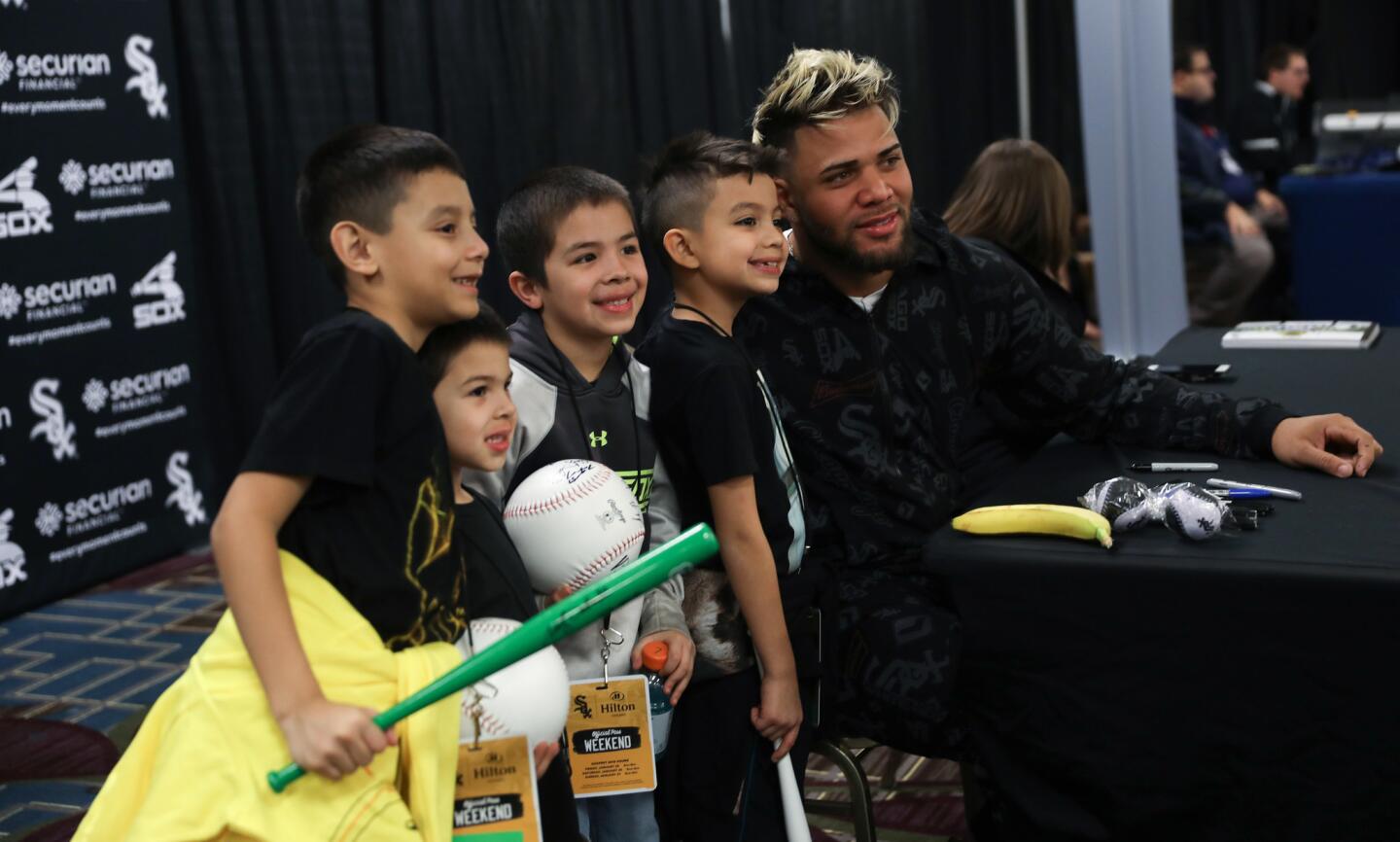From left, White Sox fans A.J. Melendez, 8, Jaxson Rubio, 5, Liam Rubio, 7, and Isius Maciel, 7, pose for a photo with the Sox's Yoan Moncada on Jan. 26, 2019, at the Hilton Chicago.