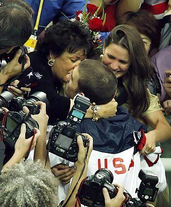 Phelps hugs mom