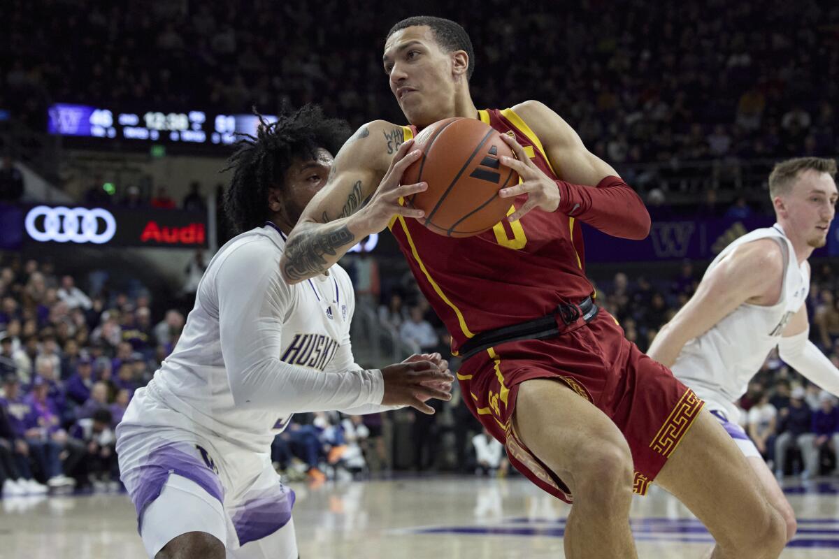 USC's Kobe Johnson drives to the basketball during a game against Washington in March.