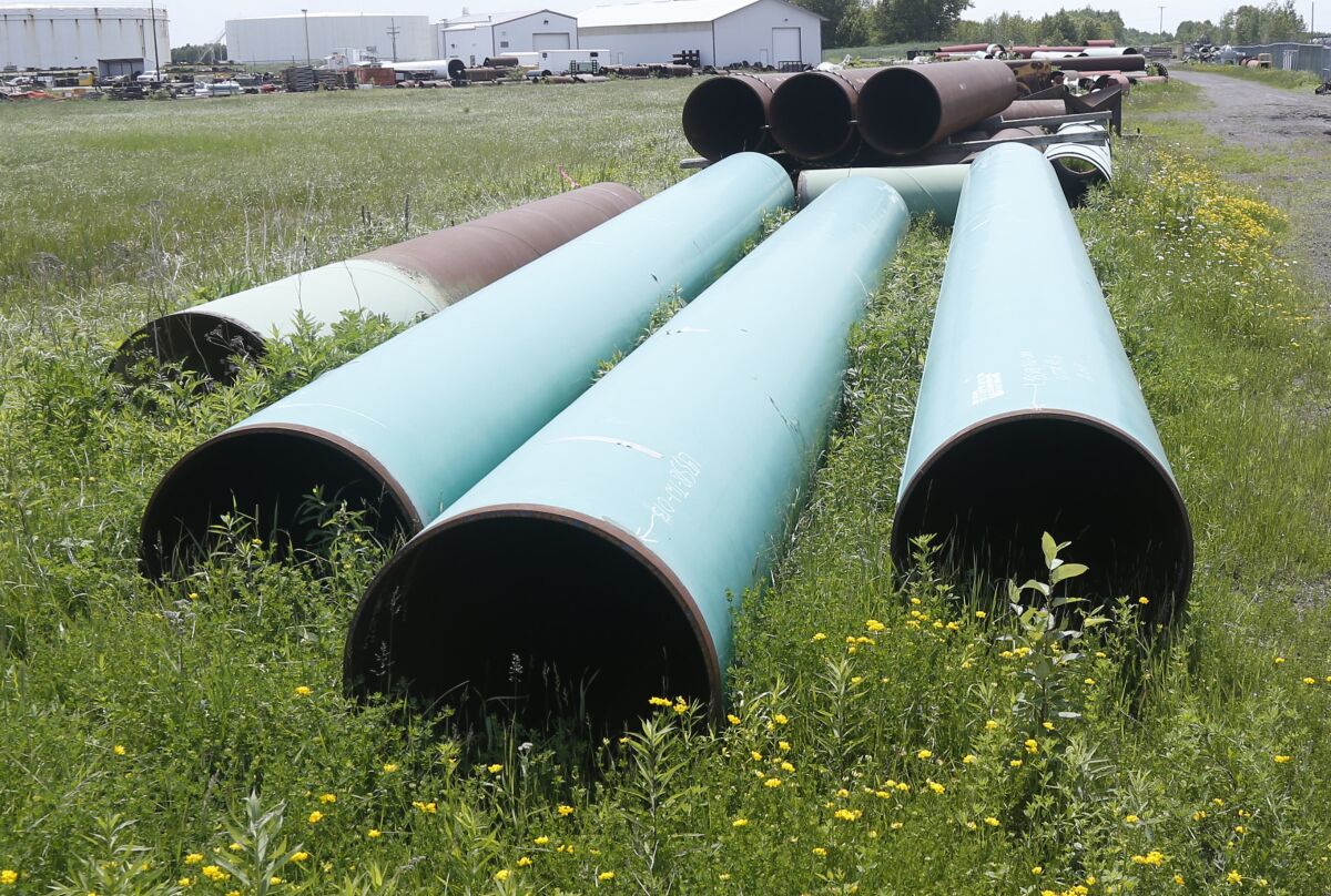 FILE - In this June 29, 2018, file photo, pipeline used to carry crude oil is shown at the Superior, Wis., terminal of Enbridge Energy. A significant permit has been granted to Enbridge's plan to replace its aging Line 3 oil pipeline across northern Minnesota. (AP Photo/Jim Mone, File)