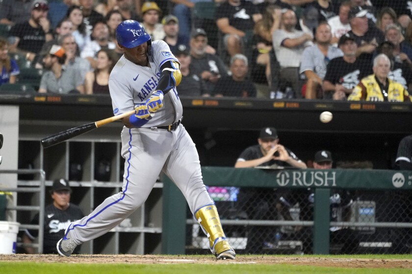 Kansas City Royals' Salvador Perez swings into a home run off Chicago White Sox starting pitcher Michael Kopech during the fourth inning of a baseball game Monday, Aug. 1, 2022, in Chicago. (AP Photo/Charles Rex Arbogast)