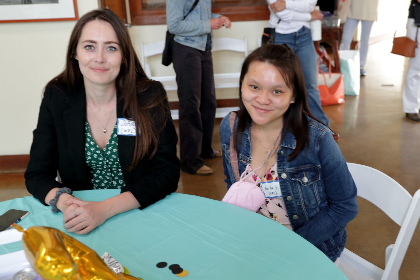 Sofia Hughes and Mei Xia Stanley representing the Women's Resource Center