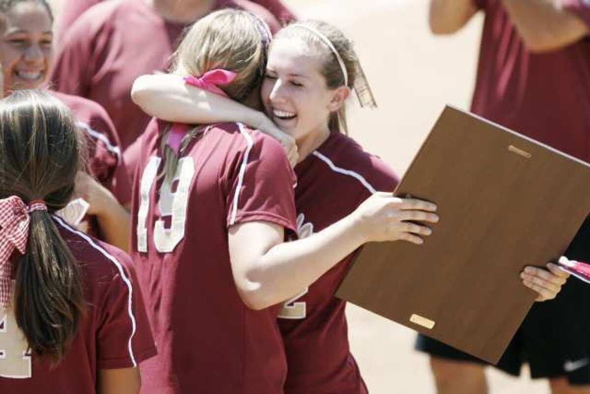 ARCHIVE PHOTO: La Canada's Lauren Cox, left, and Catherin Homer embrace each other after winning the CIF Southern Section Division V Championship against Beumont on June 2, 2012.
