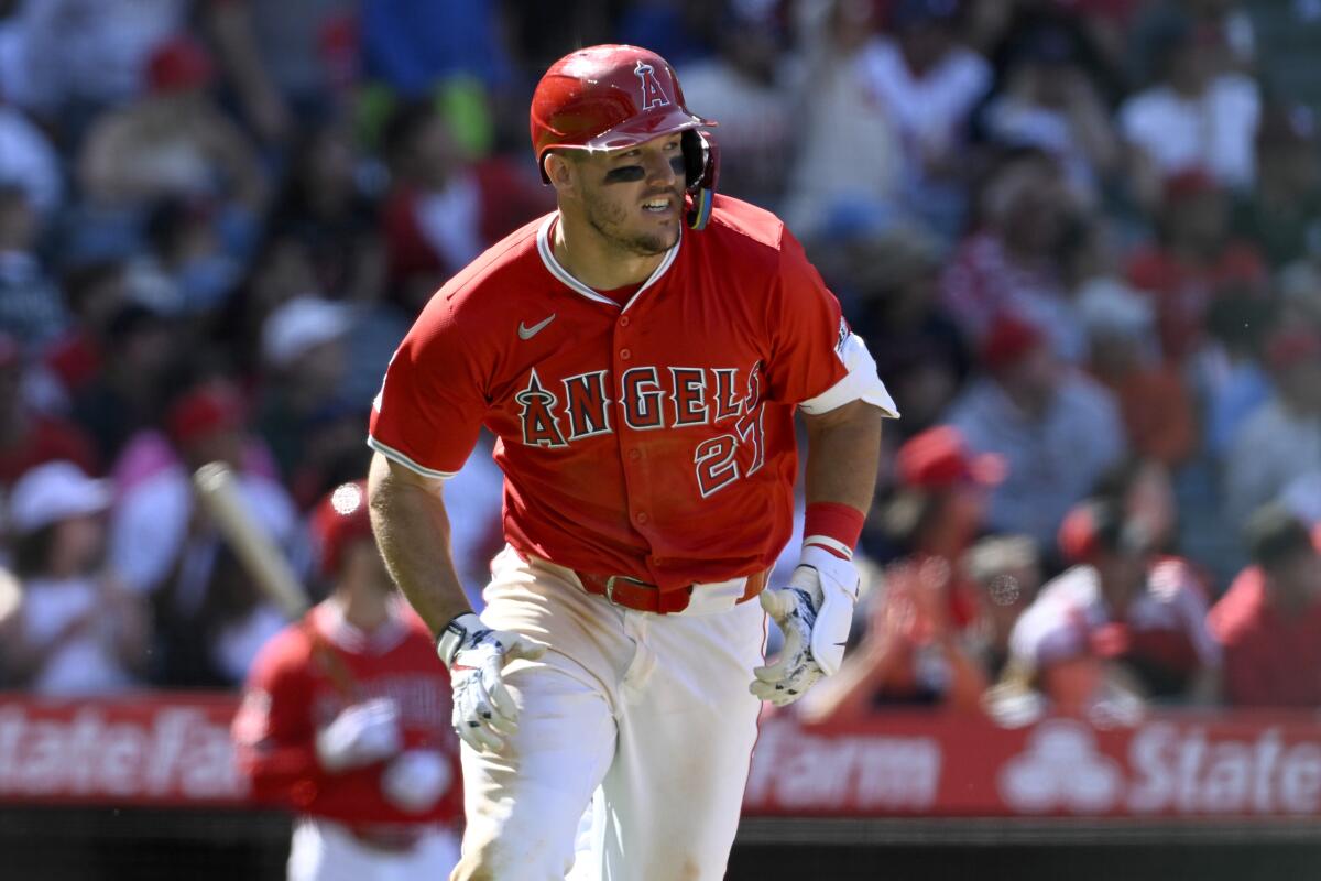 Angels star Mike Trout runs to first base after hitting a solo home run in the eighth inning.