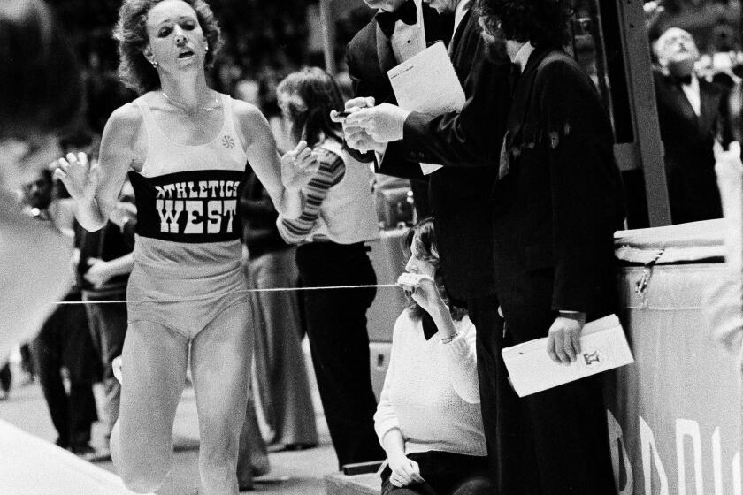 Mary Decker, representing the Athletics West, crosses the finish line at the Millrose Games to win the women's 1,500-meter event at Madison Square Garden in New York, Feb. 9, 1980. (AP Photo/Richard Drew)