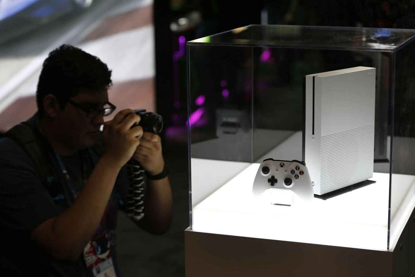 A photographer gets a view of the new Microsoft Xbox One S game console, featuring a 40% smaller console.