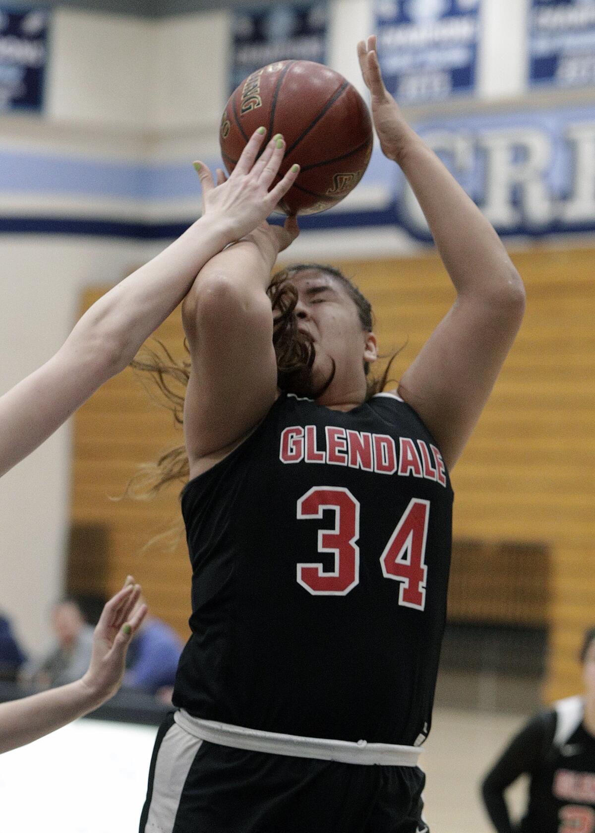 Glendale's Melissa Zamora shoots while being fouled by Crescenta Valley in a Pacific League girls' basketball game at Crescenta Valley High School on Tuesday, January 7, 2020.