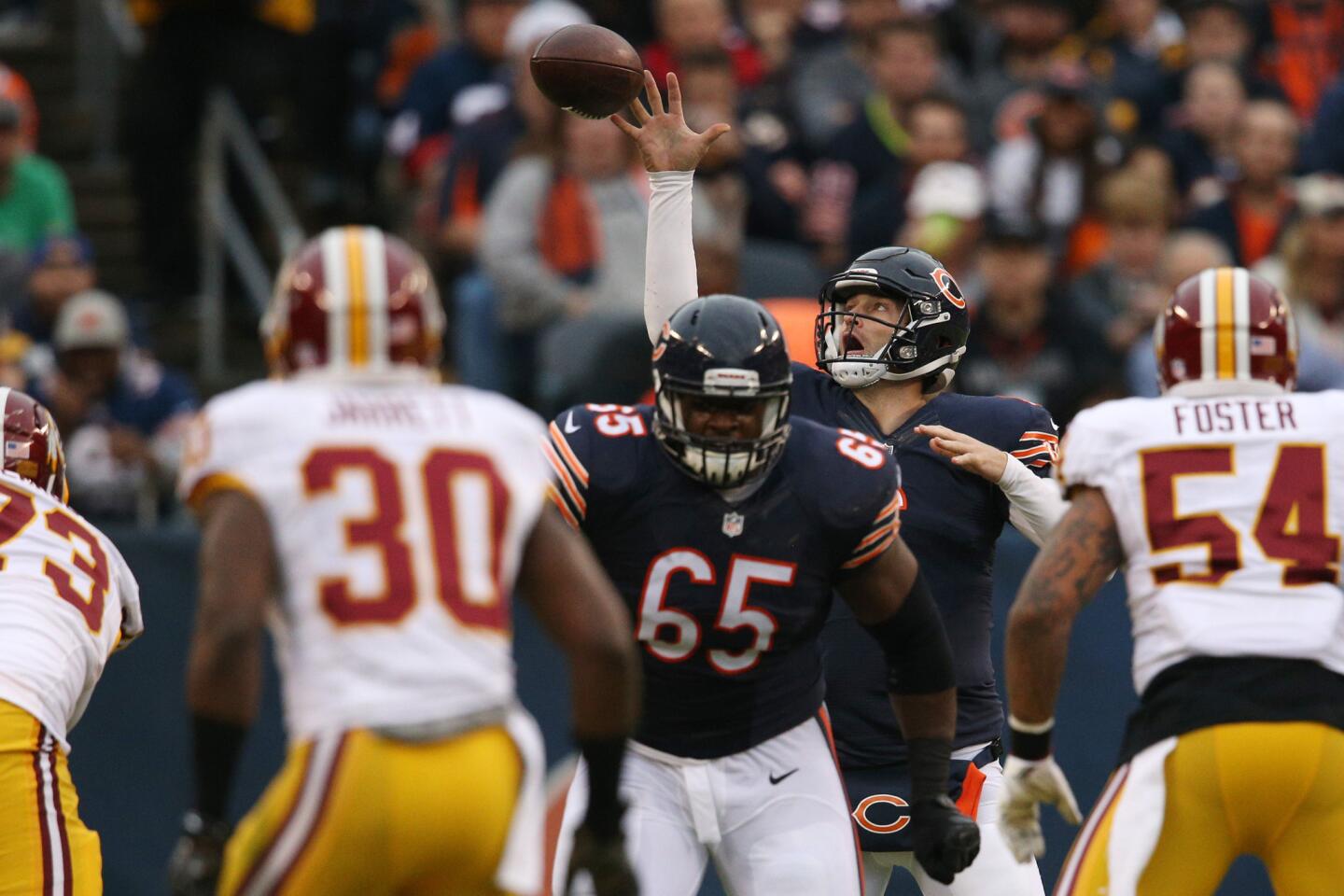 Jay Cutler nearly fumbles the snap during the first half but gets off the pass for a first down against the Redskins.