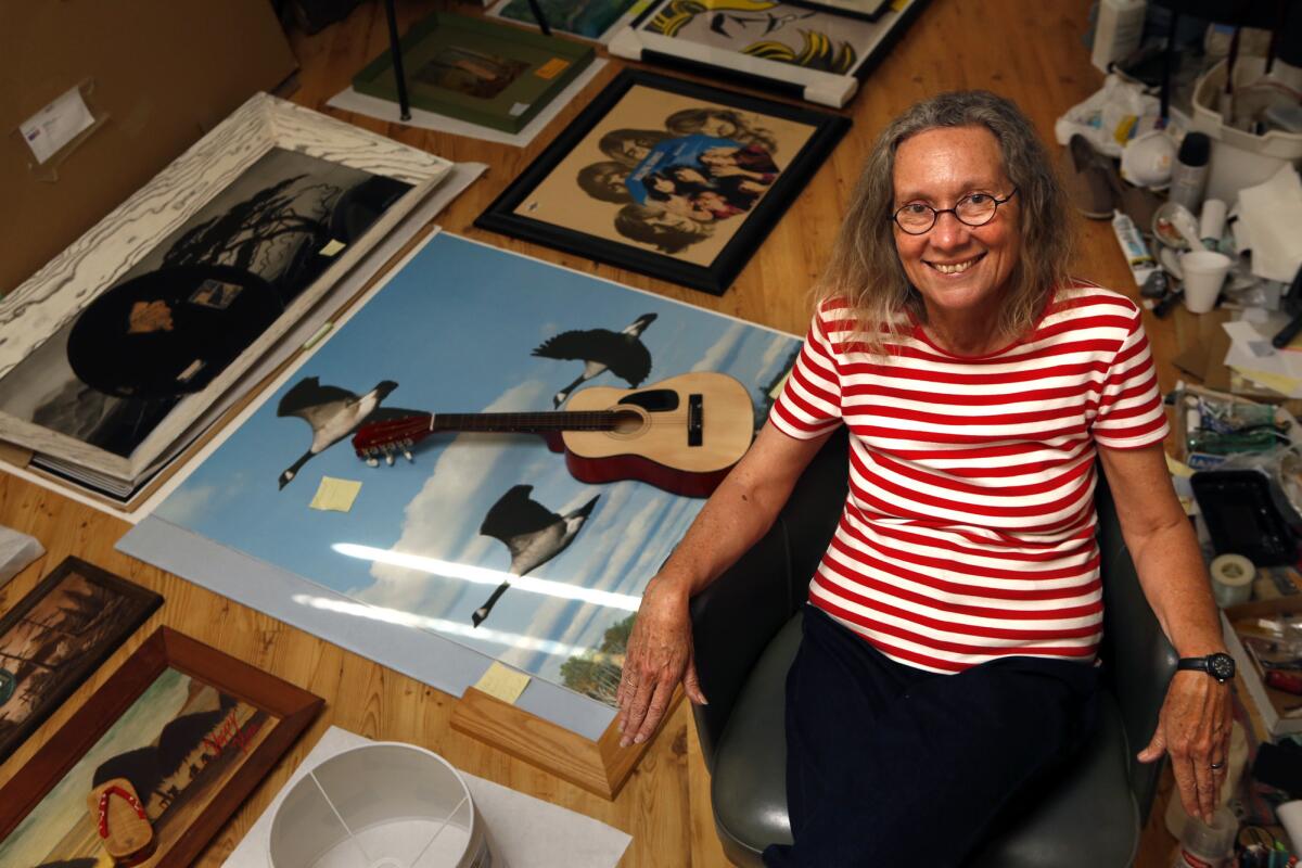 VENICE, CA - MARCH 27, 2015 -- Collage artist Alexis Smith is surrounded by her work and supplies used for creating new pieces in her studio in Venice on March 27, 2015. (Genaro Molina/Los Angeles Times)