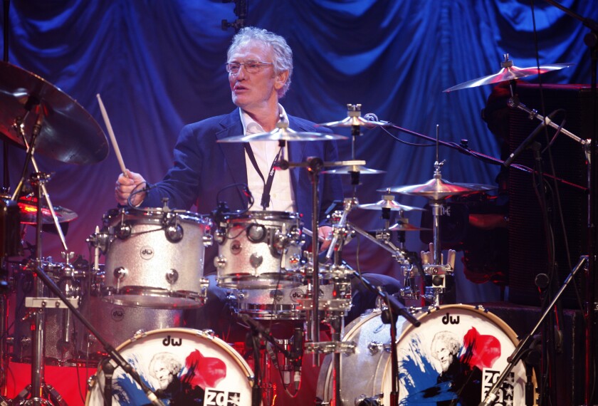 In this Sunday, Dec. 7, 2008, file photo, British musician Ginger Baker performs at the 'Zildjian Drummers Achievement Awards' at the Shepherd's Bush Empire in London. The family of drummer Ginger Baker, the volatile and propulsive British musician who was best known for his time with the power trio Cream, says he died, Sunday Oct. 6, 2019. He was 80.