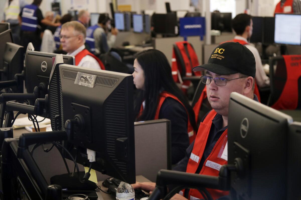 In October 2019, PG&E employees work at the utility's emergency operations center in San Francisco.