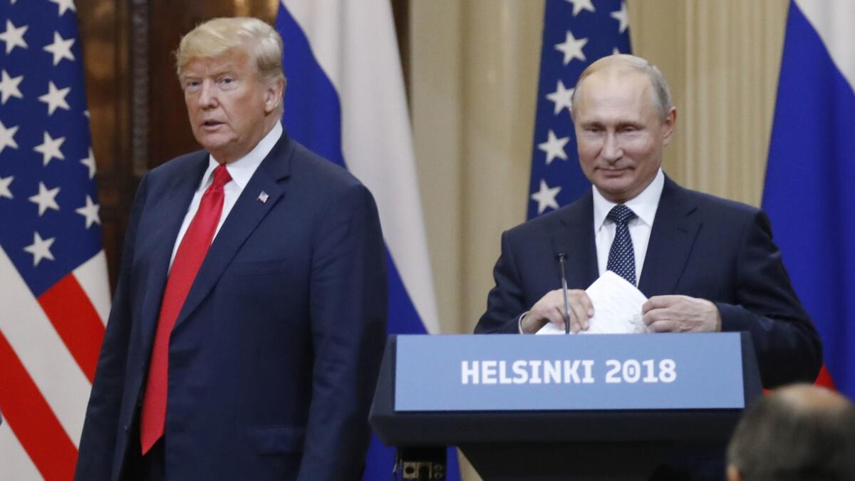 President Trump and Russian leader Vladimir Putin arrive for a news conference after their meeting in Helsinki on July 16.