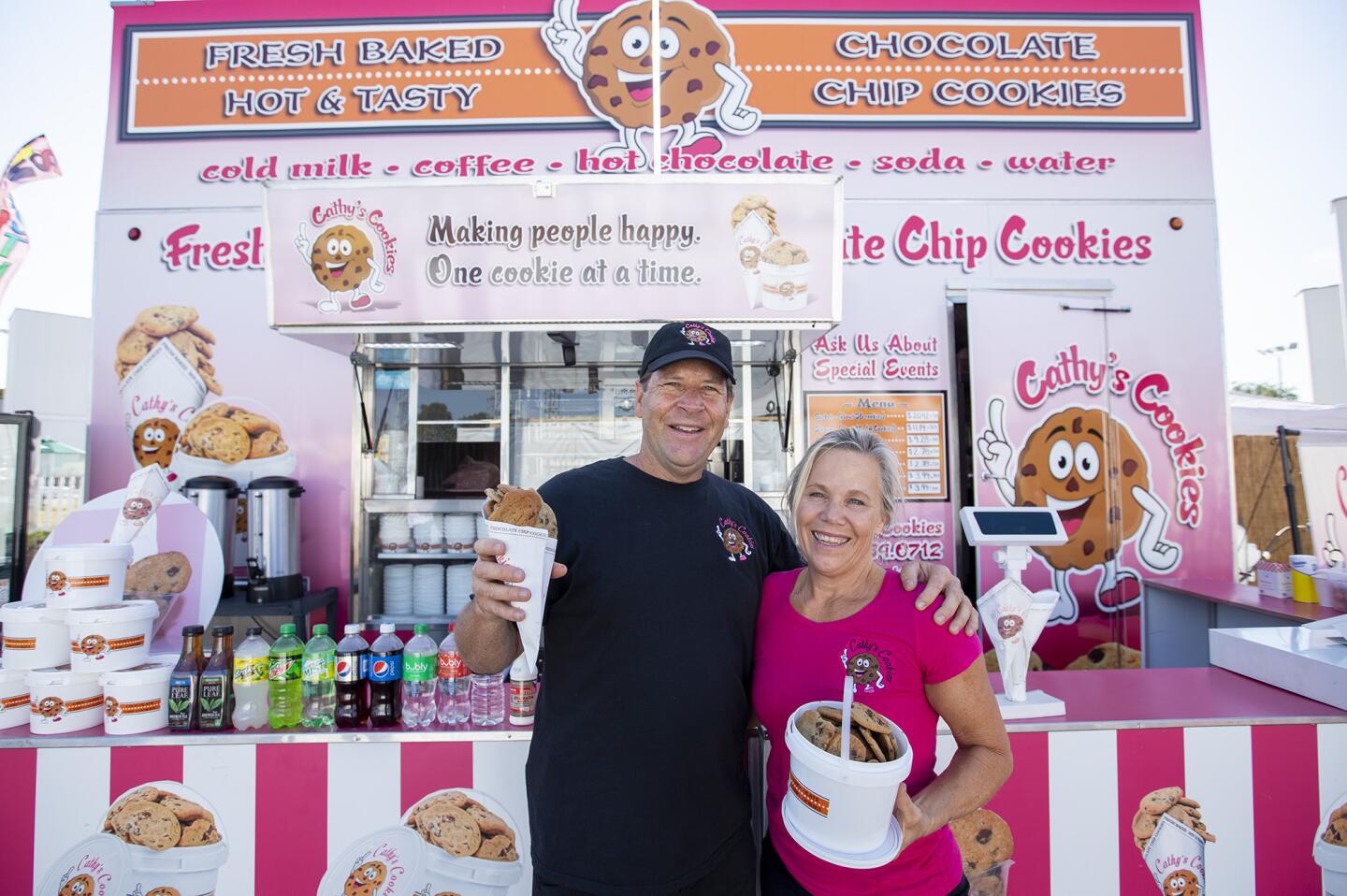 Partners Ross Alger and Cathy Johnson run the Cathy's Cookies stand, which joined the Orange County Fair last year.