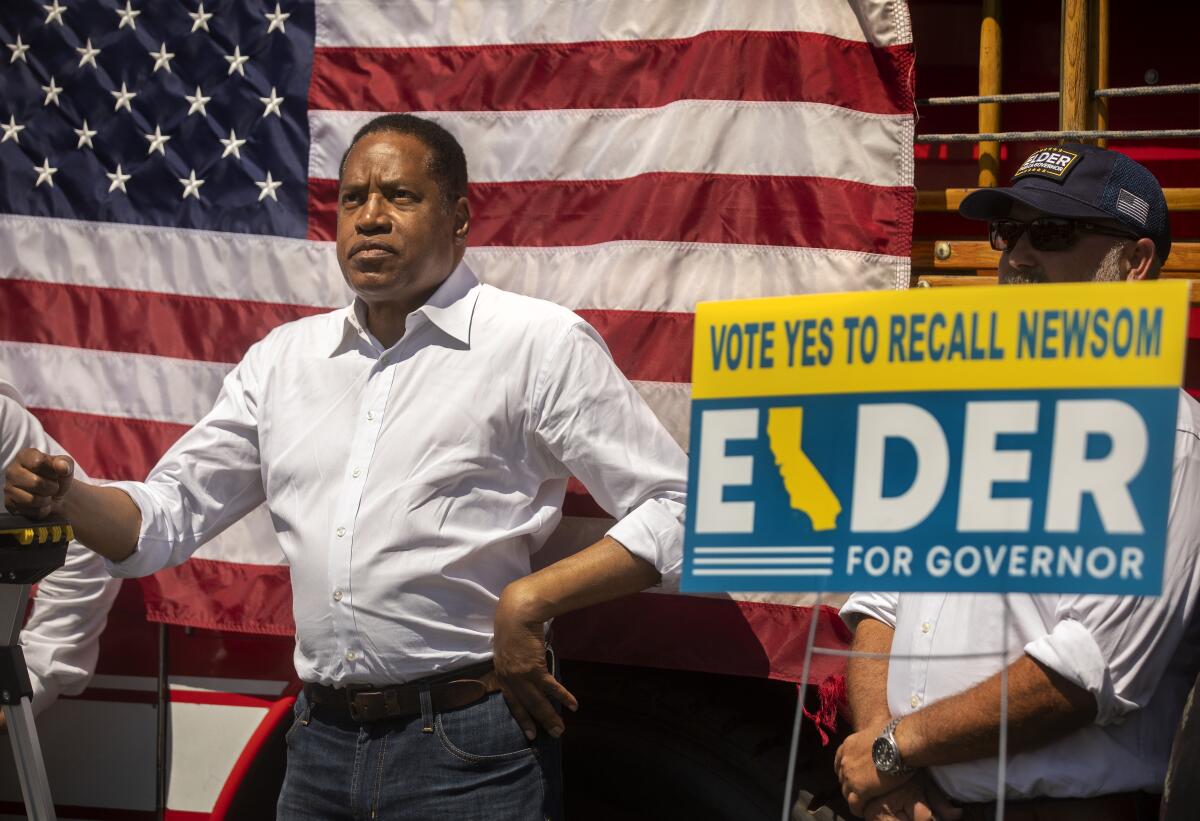 Larry Elder waits to be introduced during a rally at a Thousand Oaks mall