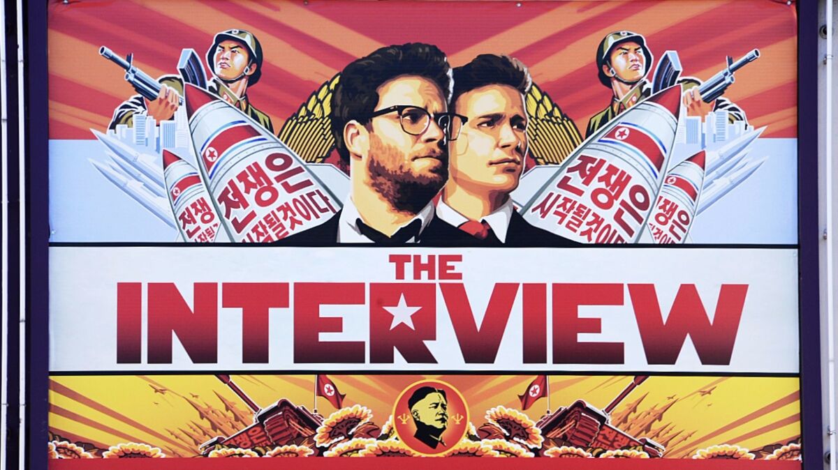 A poster for "The Interview" is displayed on the marquee of the Los Feliz 3 theater on Dec. 25, 2014, in Los Angeles.