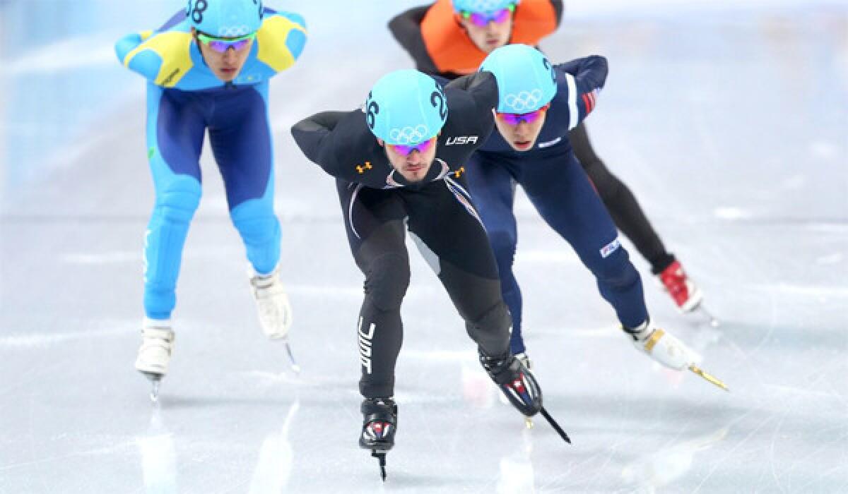 Eduardo Alvarez of the United States leads the heat as he competes in the 5,000-meter short-track relay semifinal on at the Iceberg Skating Palace.
