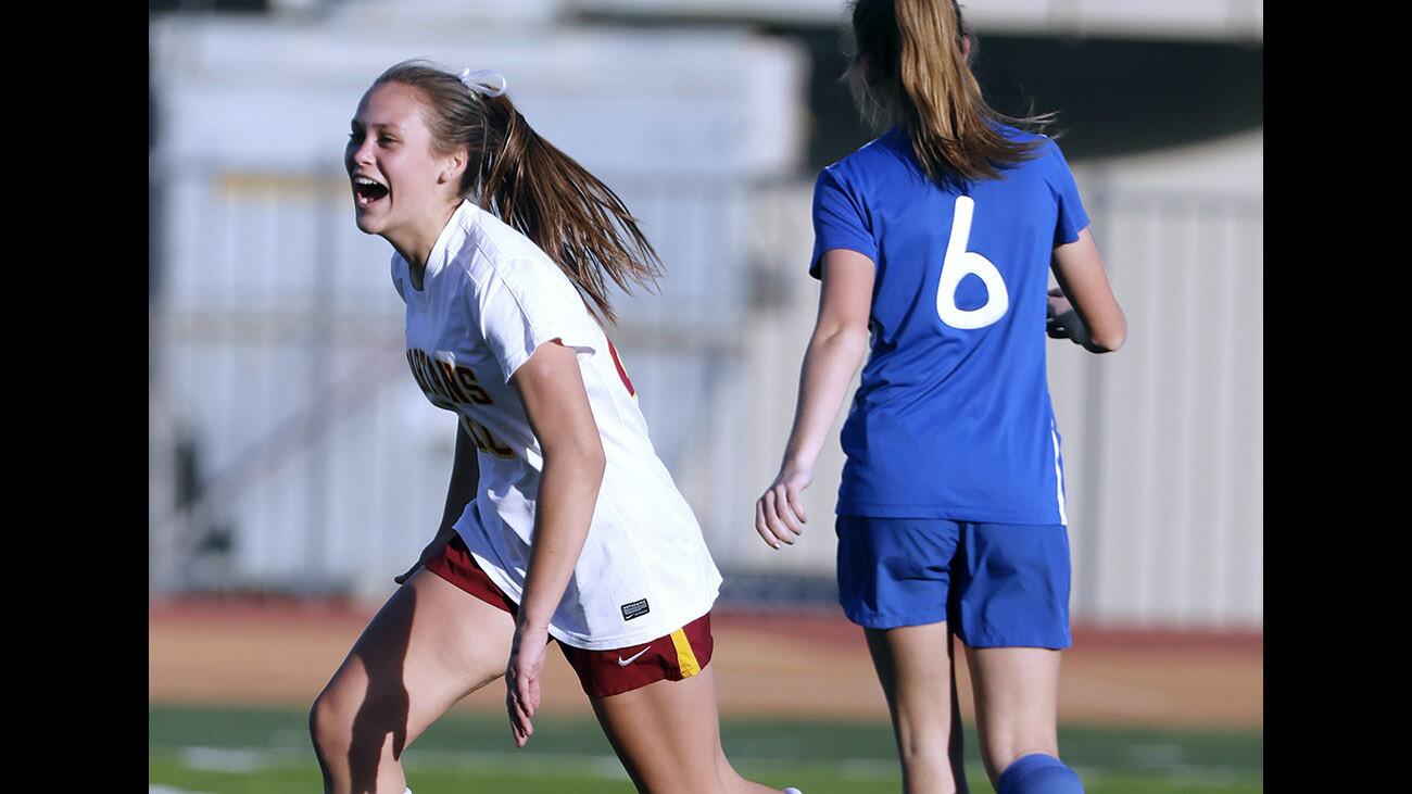 La Cañada High School girls soccer player #20 Haley Decker celebrates scoring the first goal of the game vs. San Marino High School at home in La Cañada Flintridge on Wednesday, Jan. 24, 2018.