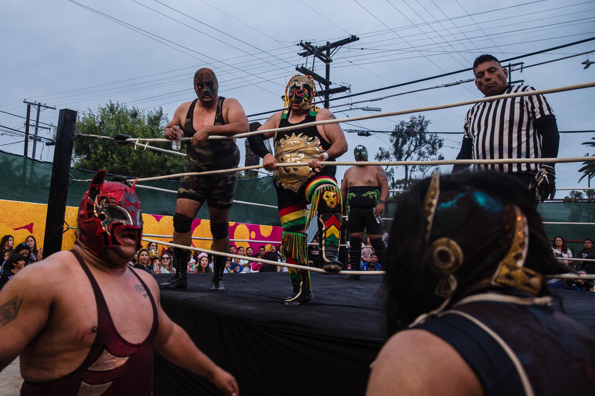 Black Mamba, Inframundo Jr., and Commando I during a match at the Baja Stars USA Lucha Libre