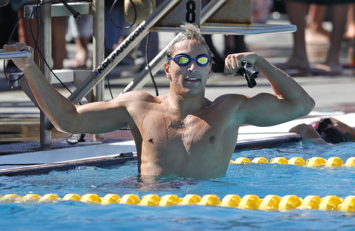 Huntington Beach swimmer Caden Cunningham reacts after winning the 200-yard medley in the Wave League championships.