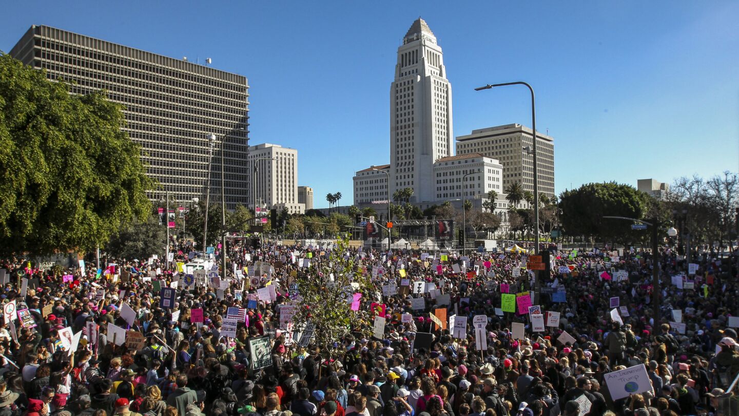 People gather in front of City Hall in Los Angeles for the women's march on Saturday afternoon.