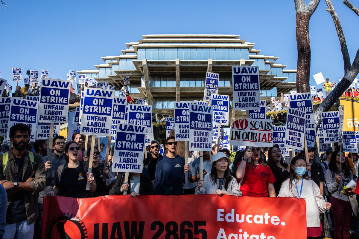 UC San Diego academic workers strike in front of Geisel Library in November, calling for higher wages and more.