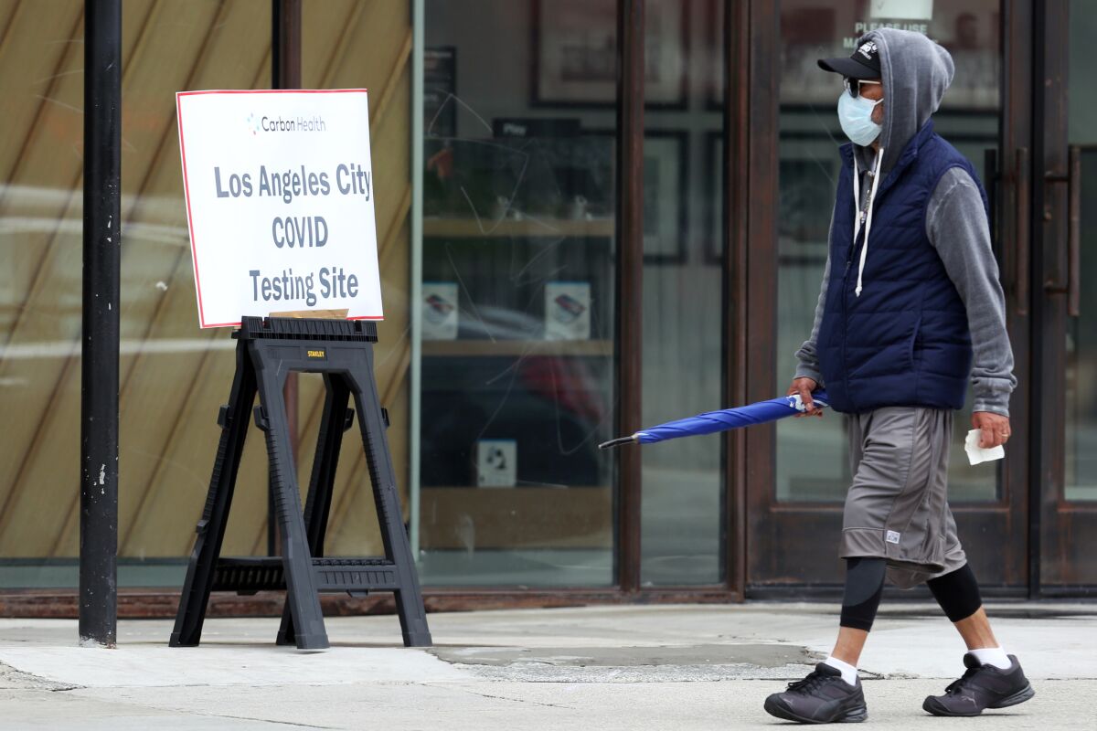 A person arrives at Carbon Health, a coronavirus testing site in Echo Park, on Wednesday. The site offers walk-up testing, which will be available at Kedren Community Health Center in South Los Angeles beginning Tuesday.