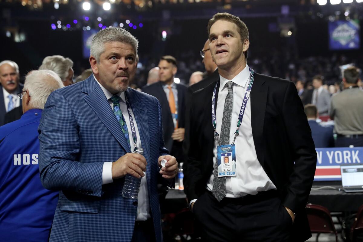 Kings coach Todd McLellan and Kings president Luc Robitaille attend the first round of the 2019 NHL Draft.