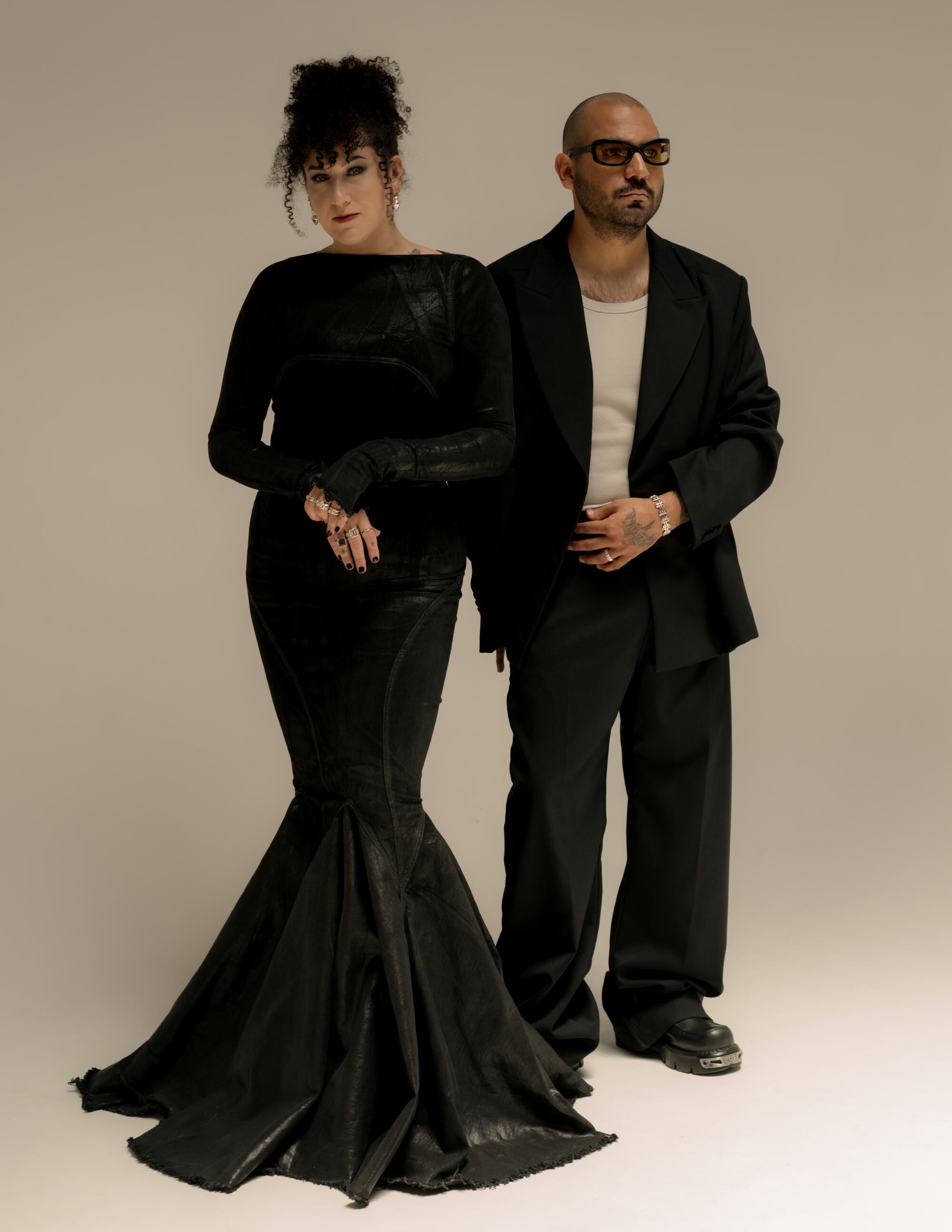 Zana wears black gown and Mariano wears black suit.