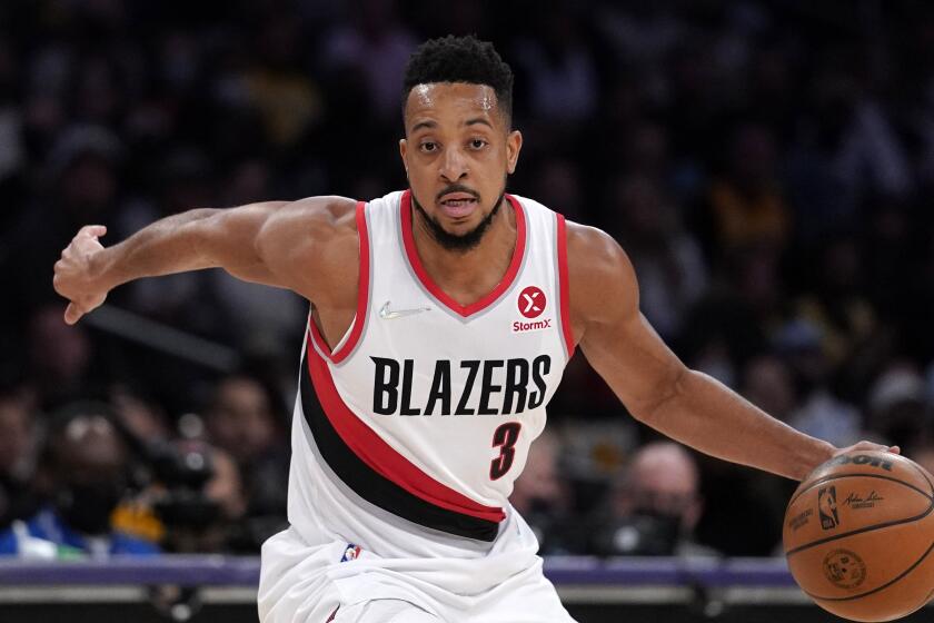Portland Trail Blazers guard CJ McCollum dribbles during the second half of an NBA basketball game against the Los Angeles Lakers Wednesday, Feb. 2, 2022, in Los Angeles. (AP Photo/Mark J. Terrill)