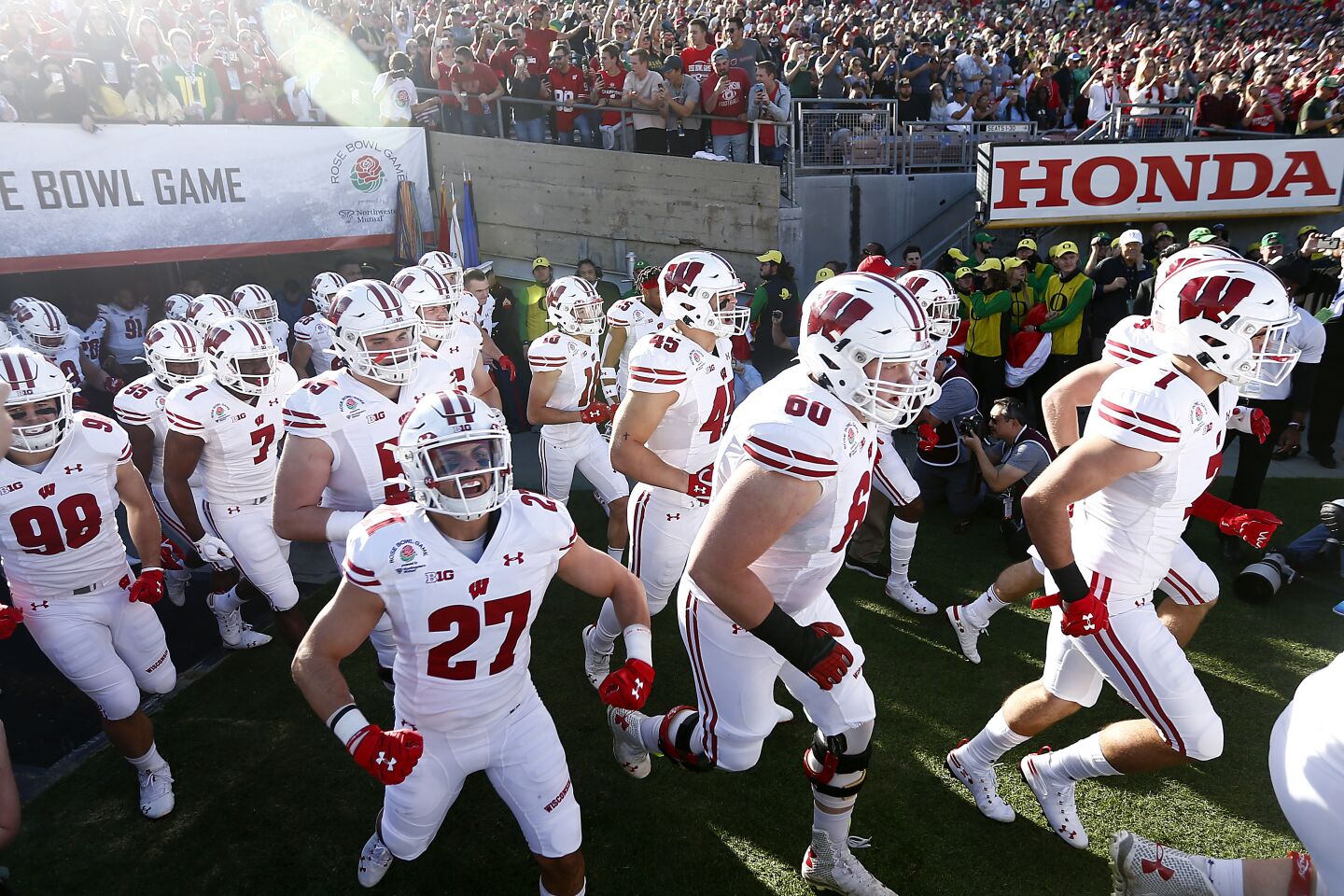 Wisconsin takes the field before the start of the Rose Bowl Game against Oregon.