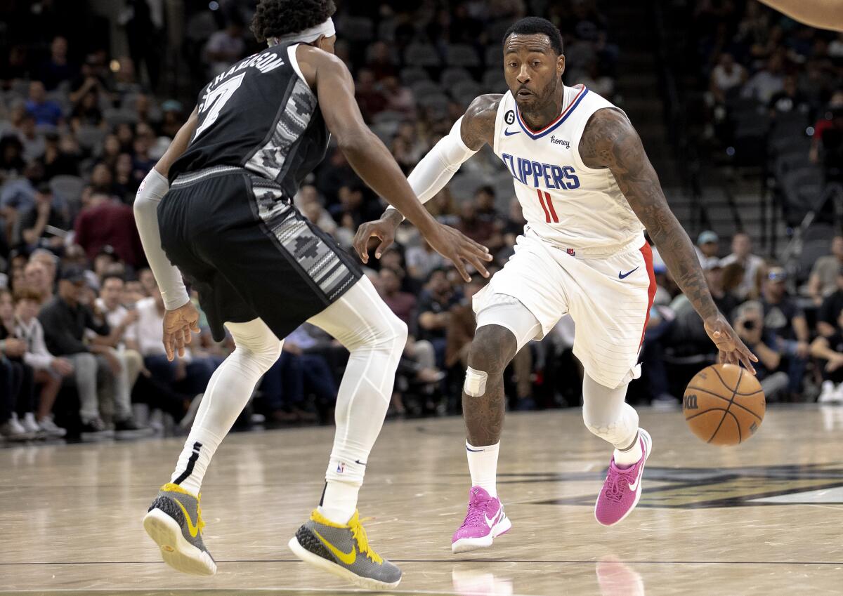 Clippers guard John Wall drives against San Antonio Spurs guard Josh Richardson.