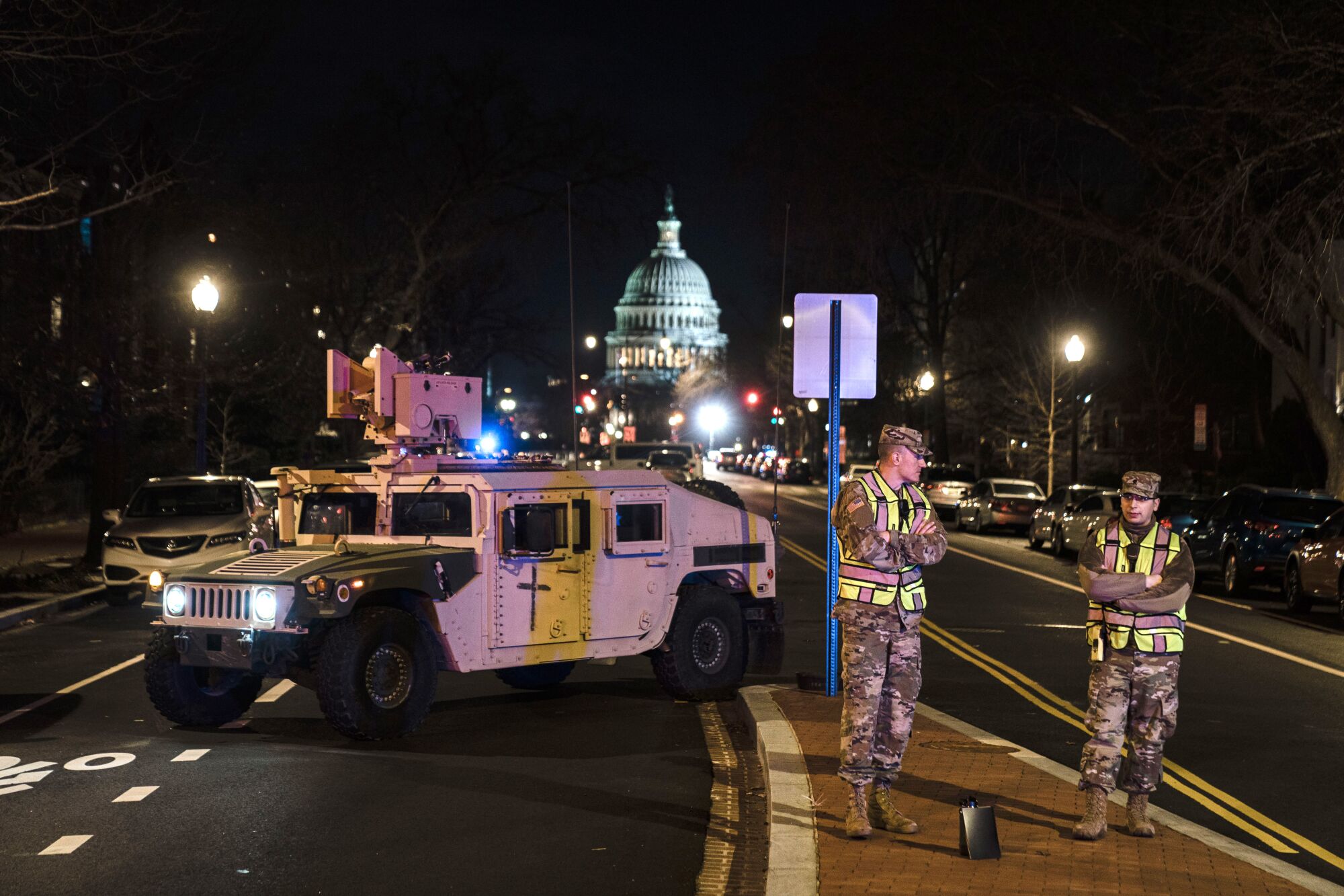 Troops block a street near the U.S. Capitol.