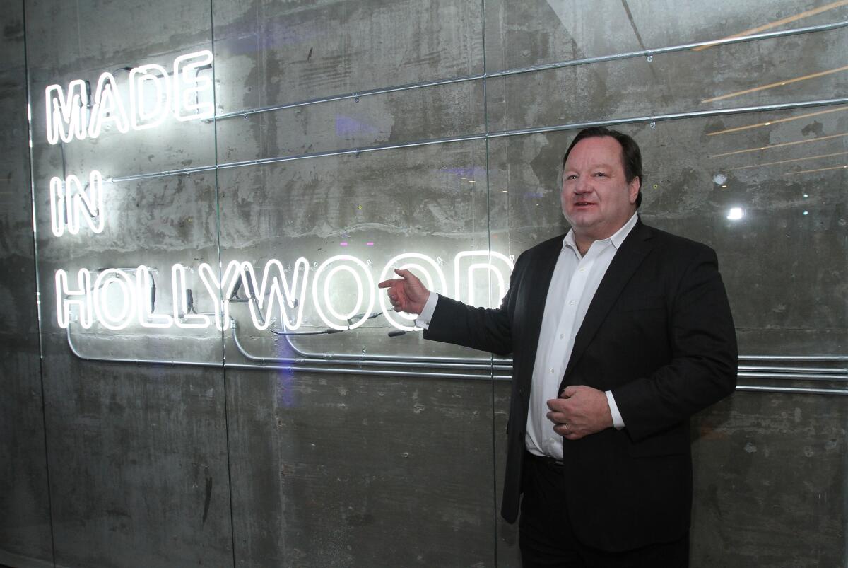 Bob Bakish stands in front of a neon sign that says "Made in Hollywood."