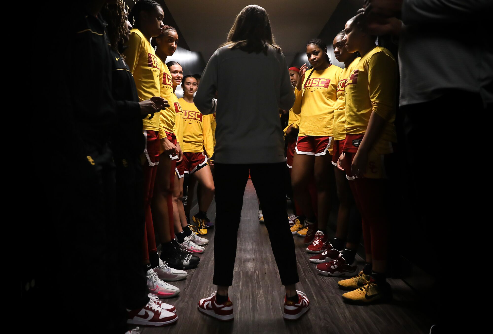 Lindsay Gottlieb talks to her players before a game against Colorado.
