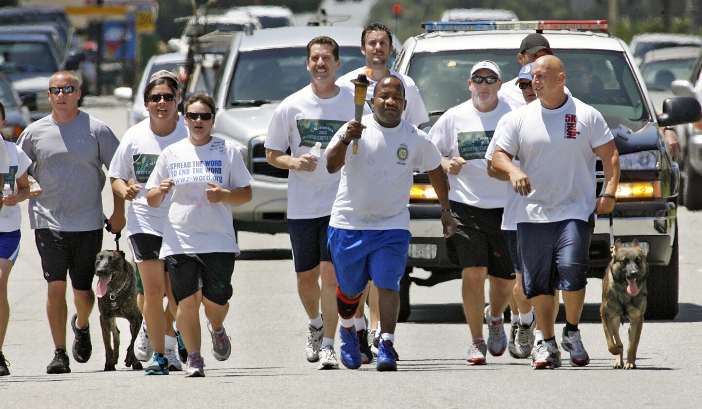 Burbank police officers and Special Olympic athletes finish the Burbank leg of the Special Olympics Torch Run on Wednesday, June 6, 2012.