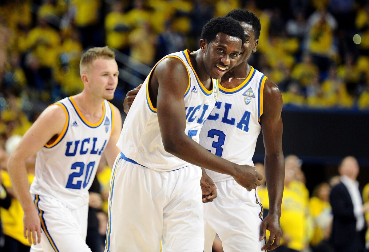 UCLA's Prince Ali celebrates a dunk against Kentucky.