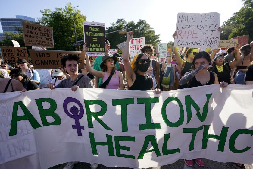 FILE - Demonstrators march and gather near the state capitol following the Supreme Court's decision to overturn Roe v. Wade on June 24, 2022, in Austin, Texas. The state of Texas sued the federal government, Thursday, July 14, 2022, after the Biden administration said federal rules require hospitals to provide abortions if the procedure is necessary to save a mother’s life. (AP Photo/Eric Gay, File)