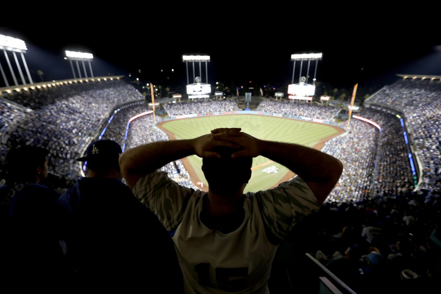A frustrated Dodgers fan watches the game in the fifth inning.