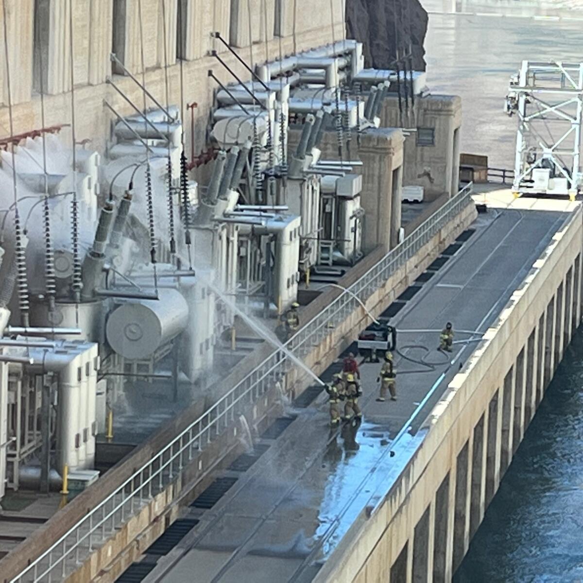 A fire crew puts out flames at the Hoover Dam.