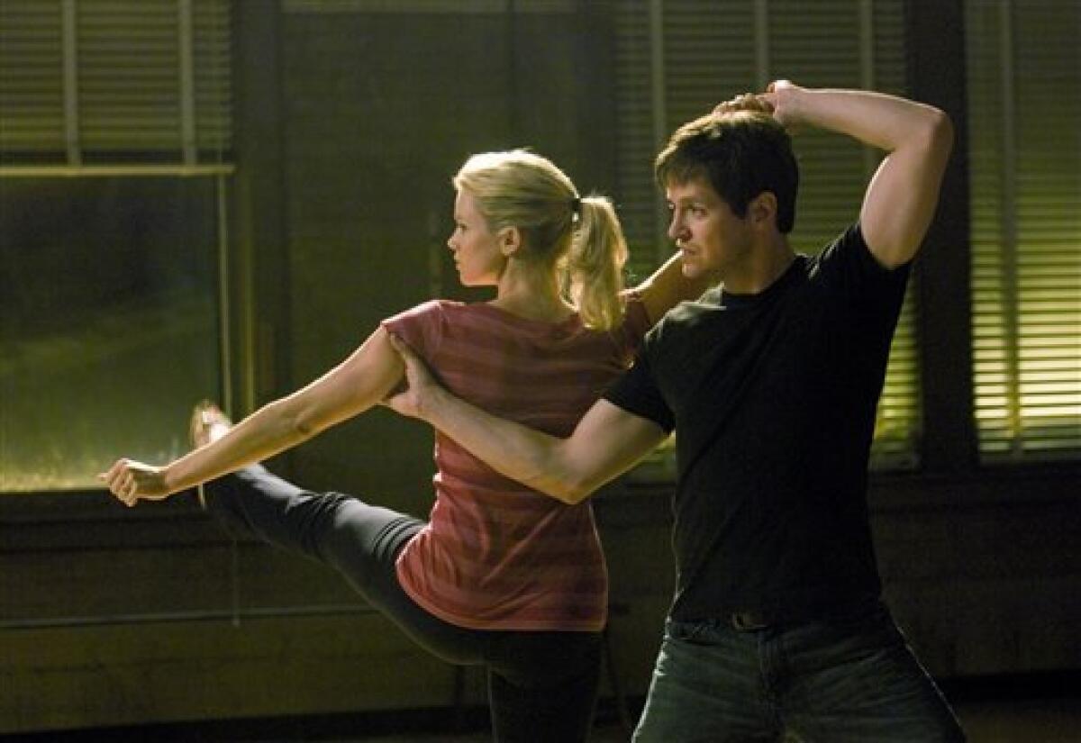 In this film publicity image released by Screen Media Films, Amy Smart, left, and Tom Malloy are shown in a scene from "Love N' Dancing." (AP Photo/Screen Media Films)