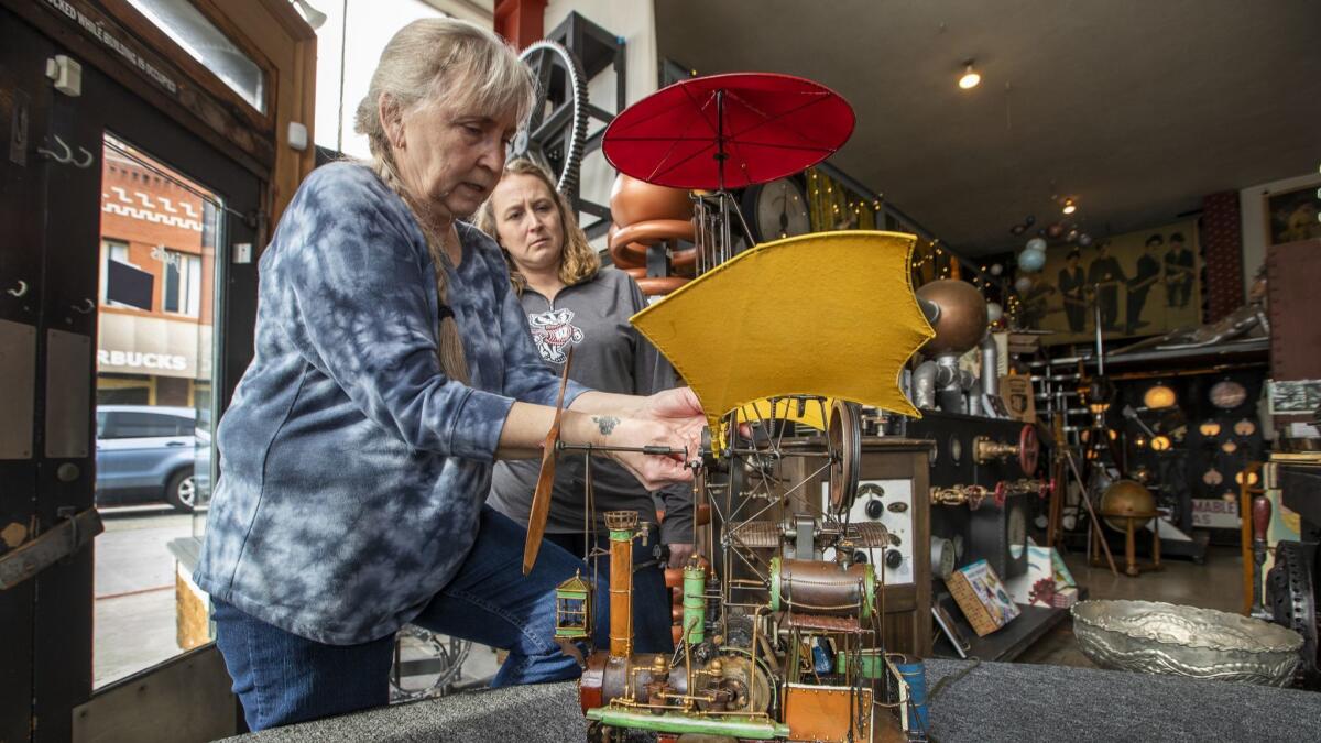 Donna Wachtendonk, left, and daughter Katye Stilen, repairing one of their airships at Jadis.