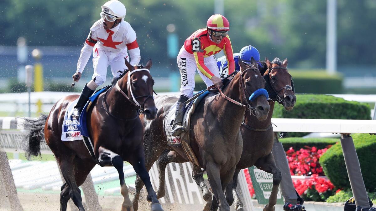 Mitole, at left with jockey Ricardo Santana Jr. aboard, edges out Arcadia-based McKinzie, ridden by Mike Smith, to win the Metropolitan Mile on the Belmont Stakes undercard Saturday.