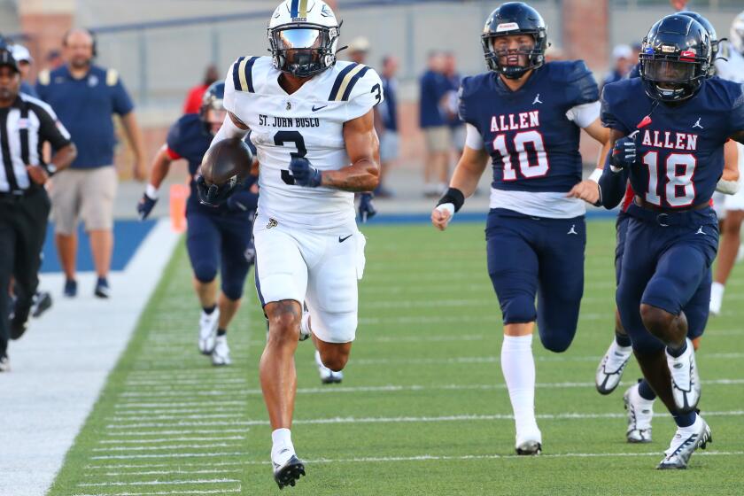 St. John Bosco's DeAndre Moore breaks into the secondary as Allen Texas defenders gives chase Friday night. Phote by Neil Fonville / TexasSportsPhotos, LLC
