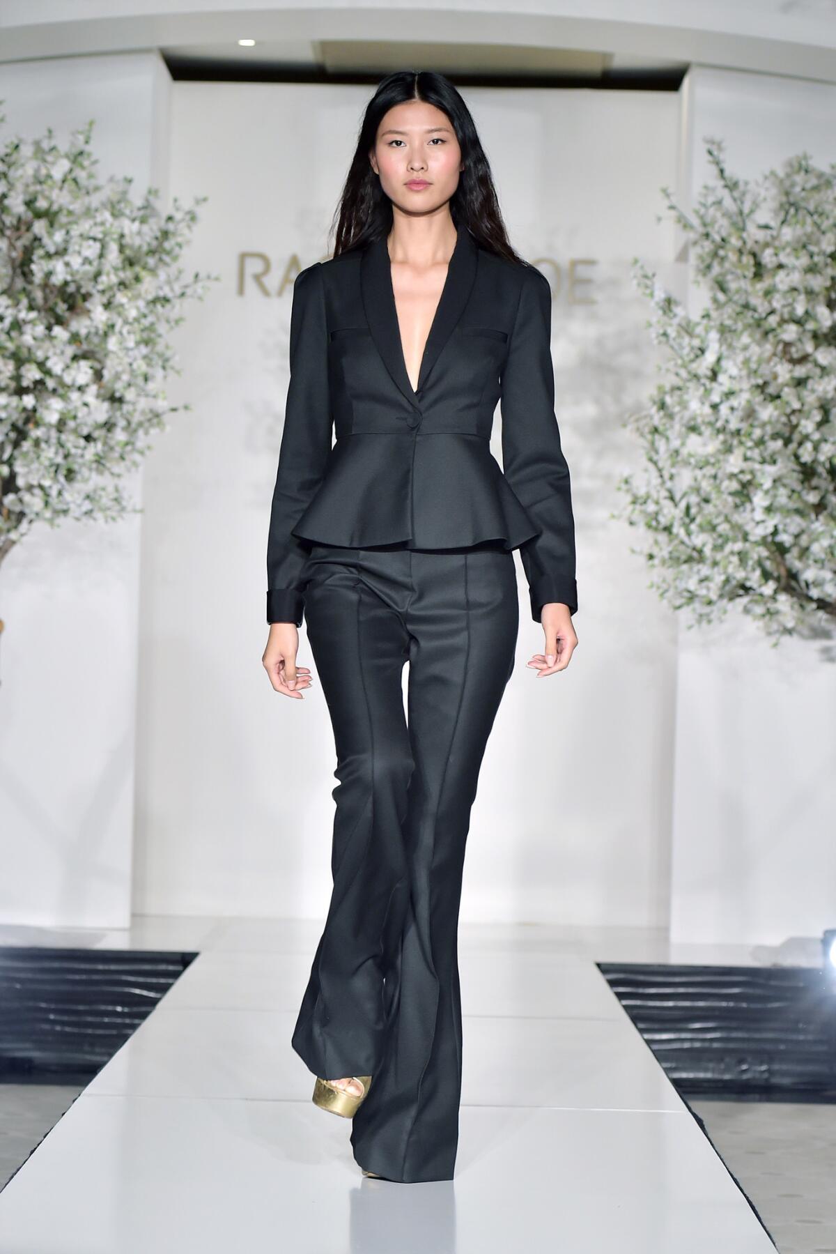 One runway look from Zoe's spring 2019 collection was a suit with dramatic flares.