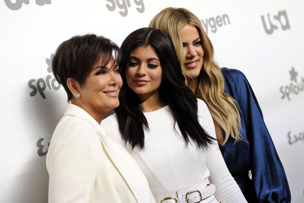 FILE - Television personalities Kris Jenner, from left, Kylie Jenner and Khloe Kardashian attend the NBCUniversal Cable Entertainment 2015 Upfront at The Javits Center on Thursday, May 14, 2015, in New York. On Monday, April 18, 2022, Kris and Kylie Jenner, along with Kim and Khloe Kardashian, sat in the front row of a Los Angeles courtroom as prospective jurors aired their feelings about the famous family and the four women, all defendants in a lawsuit brought by Rob Kardashian's former fiancée Blac Chyna. (Photo by Evan Agostini/Invision/AP, File)