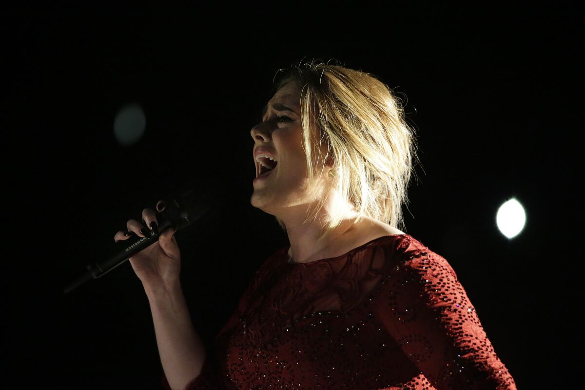 Adele performs at the 58th Grammy Awards in February. The artist has added two more dates to her extended series of concerts at Staples Center.