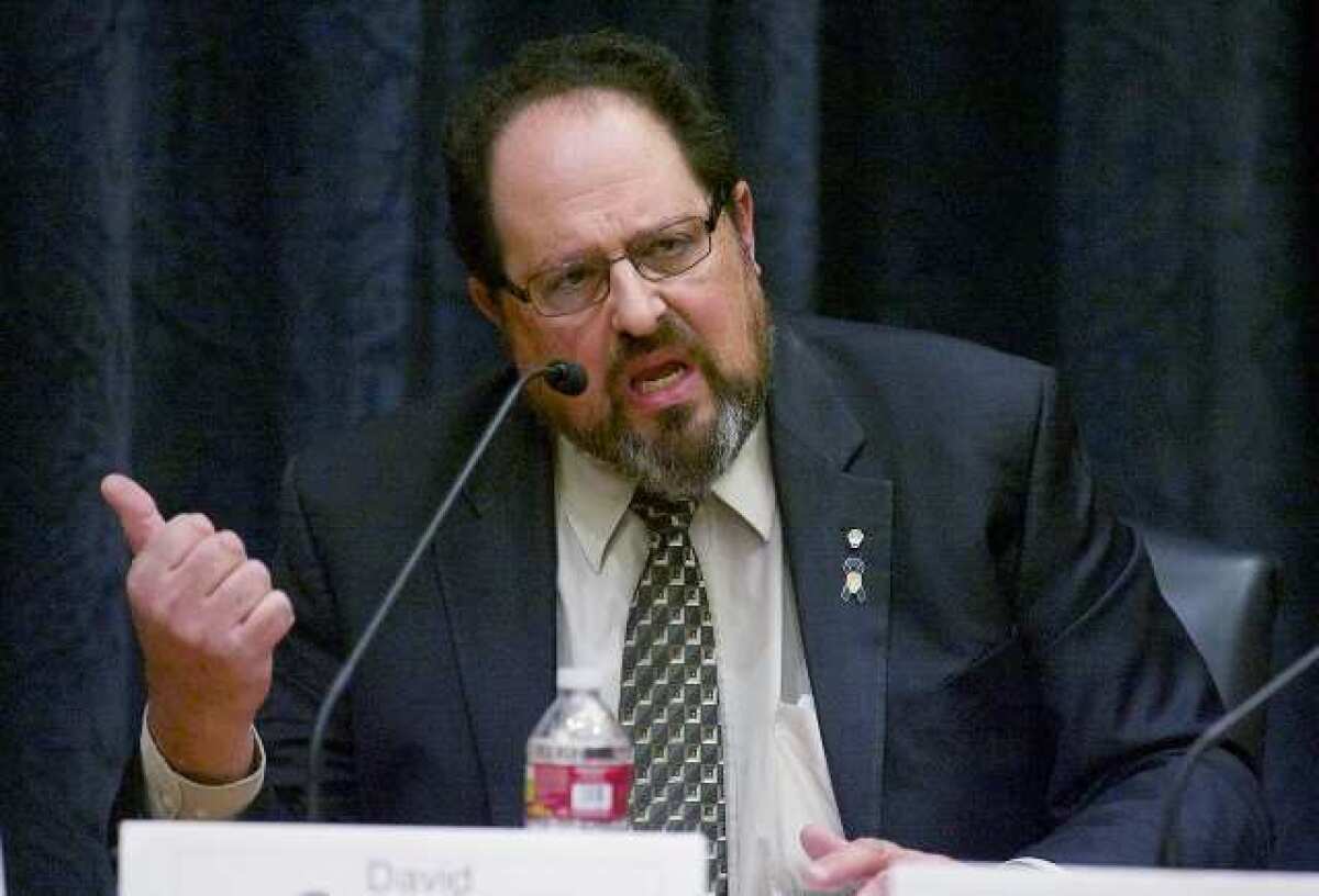 City council candidate and current council member David Gordon responds to questions in the city council chambers at Burbank City Hall where the League of Women Voters held candidate forums for the upcoming local elections.