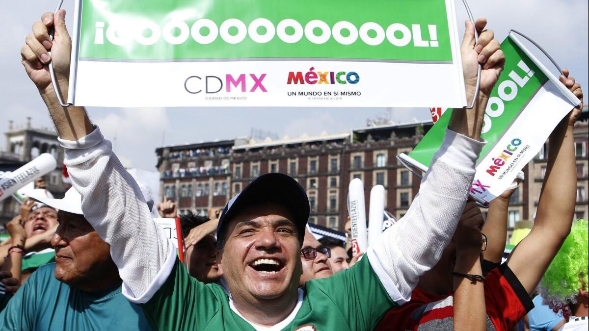 Fans of Mexico gather at the zocalo square in Mexico City on Saturday to watch the World Cup match between Mexico and South Korea.