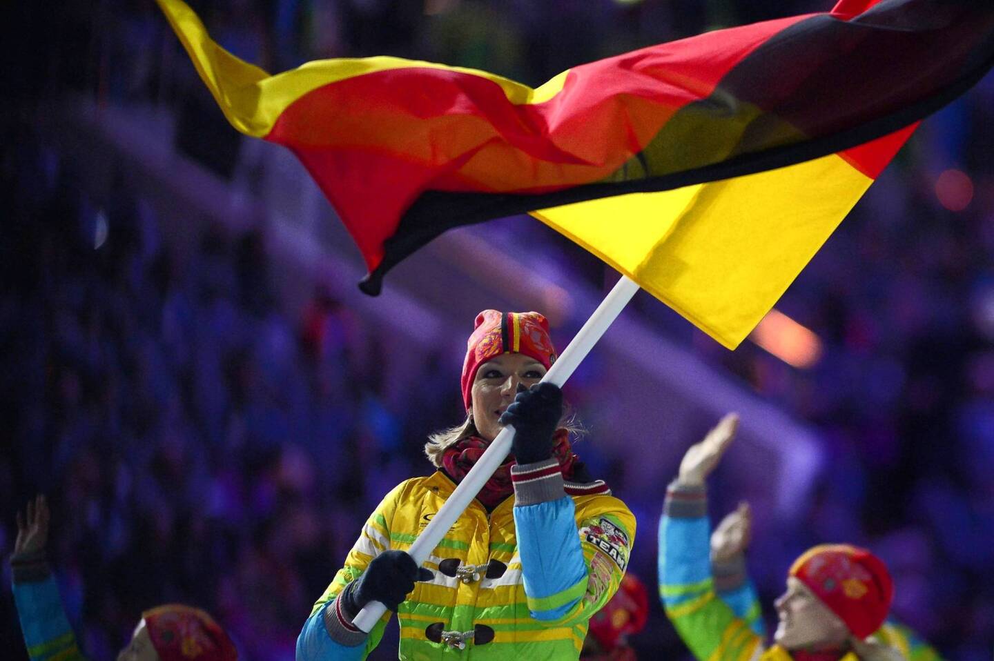 Germany's flag bearer, alpine skier Maria Hoefl-Riesch, leads her national delegation during the opening ceremony.